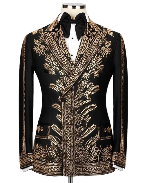 A black formal jacket with extensive gold metallic embroidery, displayed on a mannequin with a black bow tie and white shirt against a light gray background.