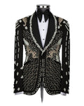 A black tuxedo jacket with ornate silver and gold beadwork and embroidery, styled on a mannequin with a white tuxedo shirt and black bow tie against a light gray background.