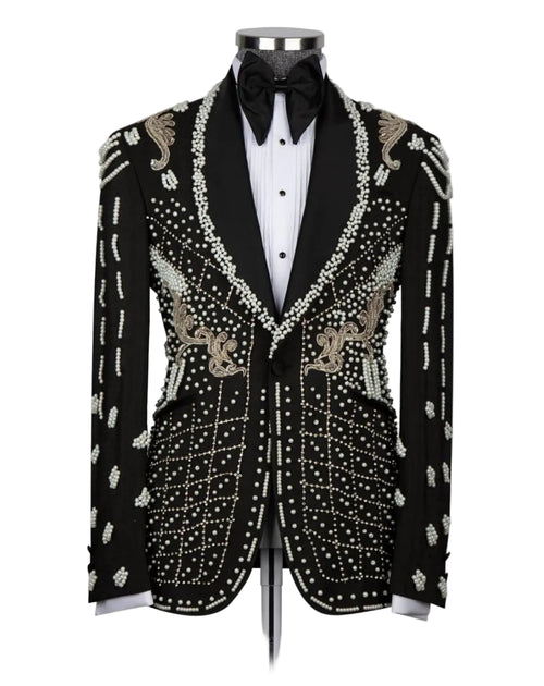 A black tuxedo jacket with ornate silver and gold beadwork and embroidery, styled on a mannequin with a white tuxedo shirt and black bow tie against a light gray background.