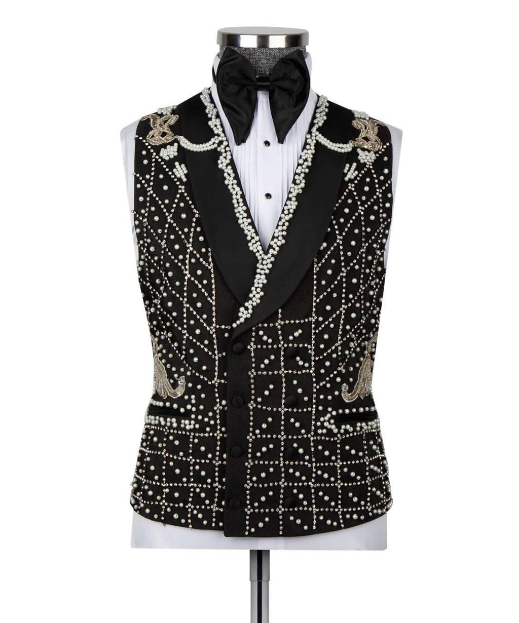 A black tuxedo vest with extensive white bead and pearl embellishments, styled on a white tuxedo shirt and black bow tie mannequin against a white background.