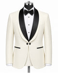 An ivory or cream tuxedo jacket with black satin shawl lapels, displayed on a mannequin with a white pinstripe shirt, black bow tie, and black buttons, against a plain white background.