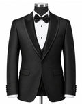 A black tuxedo jacket displayed on a mannequin torso with a white pinstripe shirt, black bow tie, and matching black vest, set against a plain white background.