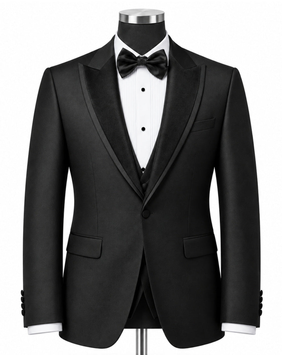 A black tuxedo jacket displayed on a mannequin torso with a white pinstripe shirt, black bow tie, and matching black vest, set against a plain white background.