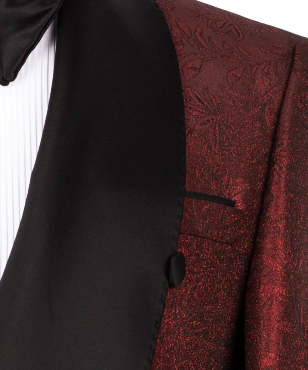 Close-up of a black and red patterned suit jacket with a button.