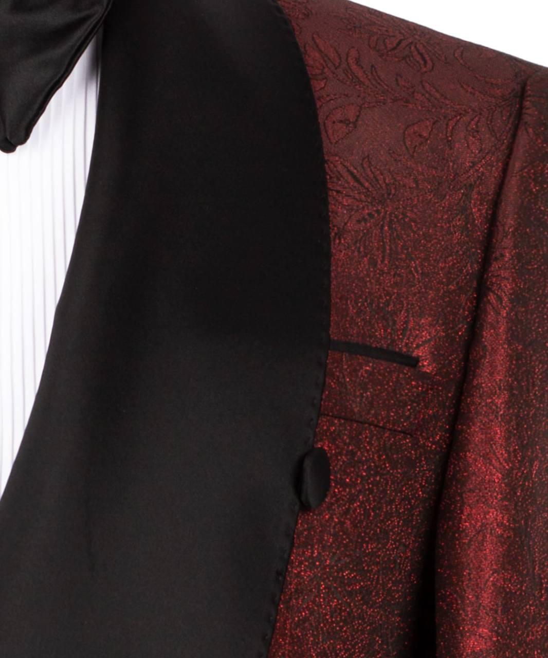 Close-up of a black and red patterned suit jacket with a button.