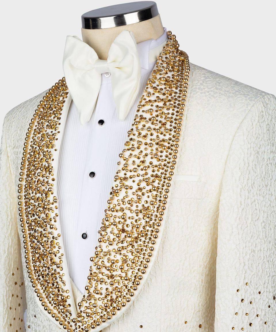 Mannequin wearing a white tuxedo with gold embellishments on a white background
