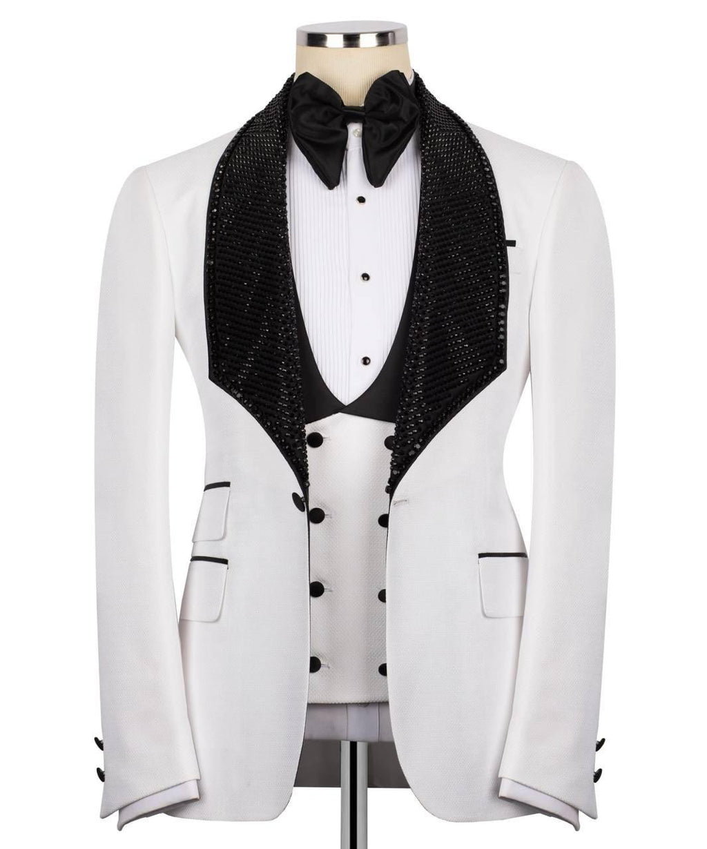 White tuxedo with black lapels and bow tie on a mannequin against a white background