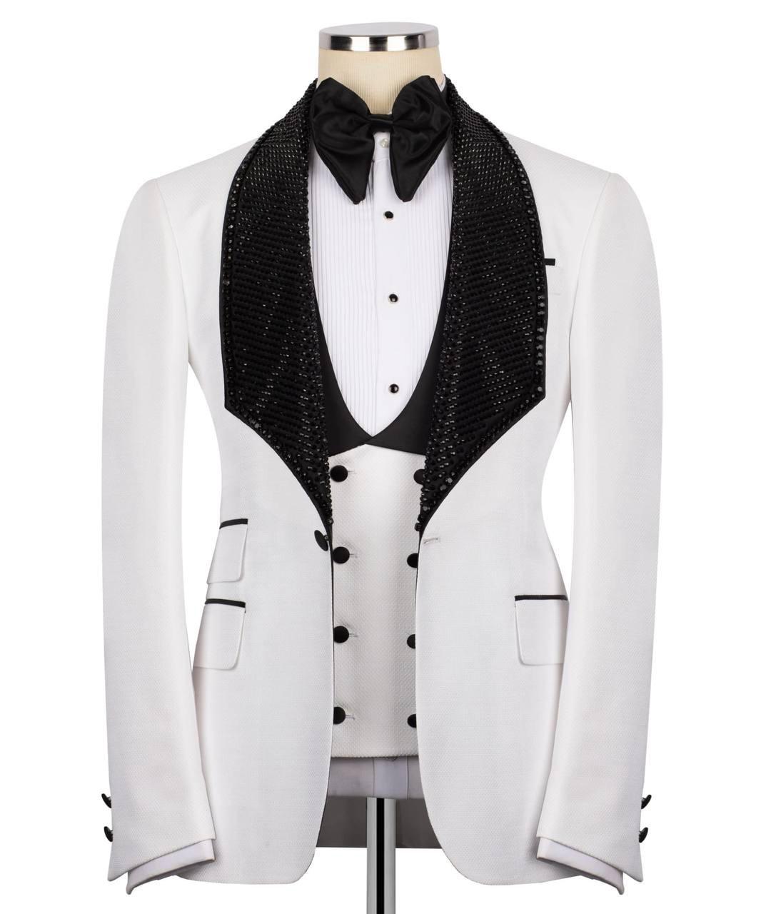 White tuxedo with black lapels and bow tie on a mannequin against a white background