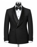 A black double-breasted tuxedo jacket with ornate black lace trim along the shawl collar, displayed on a mannequin torso with a white dress shirt, black bow tie, and white cufflinks against a plain white background.