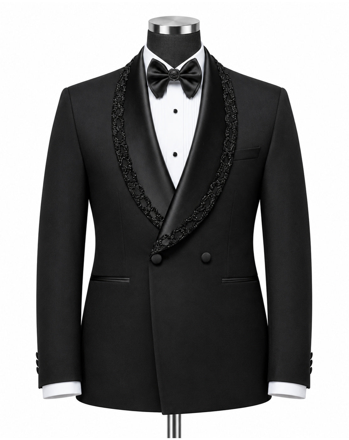 A black double-breasted tuxedo jacket with ornate black lace trim along the shawl collar, displayed on a mannequin torso with a white dress shirt, black bow tie, and white cufflinks against a plain white background.