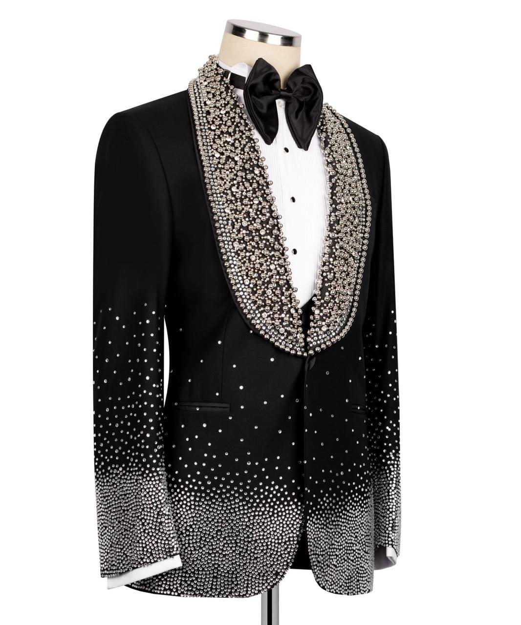 Black tuxedo with a sparkling collar on a mannequin against a white background