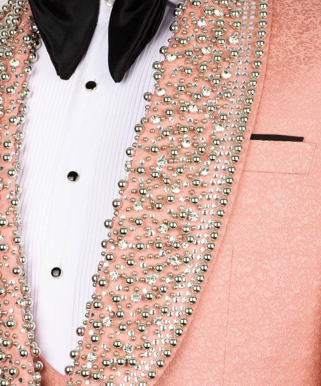 Pink blazer with silver bead embellishments on a white background