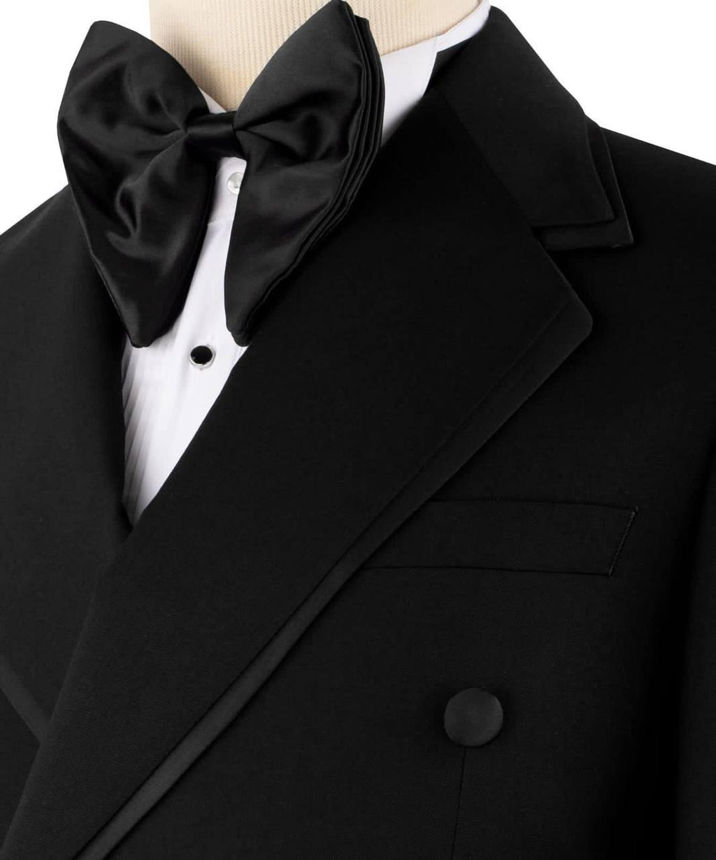 Black tuxedo with a large bow tie on a mannequin against a white background