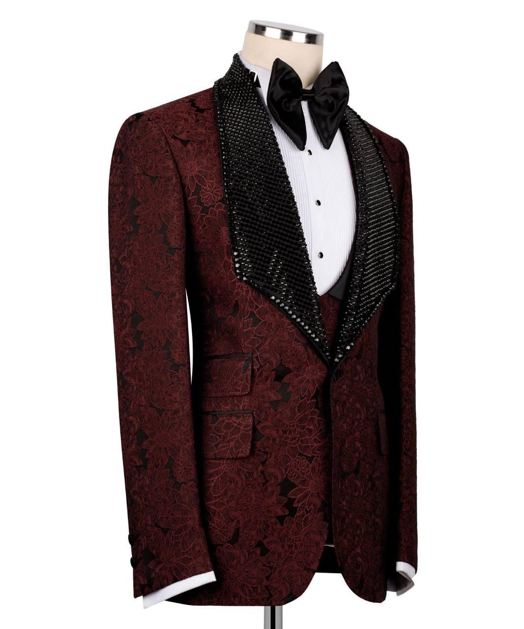 Maroon patterned suit jacket with black lapels on a mannequin against a white background