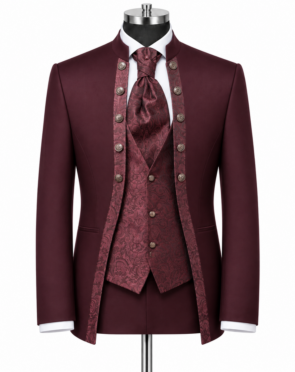 A formal three-piece suit displayed on a mannequin, featuring a deep burgundy jacket, matching waistcoat, and patterned tie, with white shirt cuffs and a white dress shirt visible.