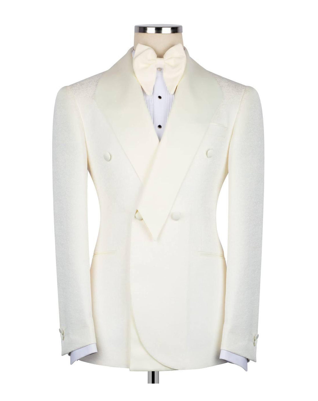An ivory double-breasted tuxedo jacket with peak lapels, displayed on a mannequin torso with a matching bow tie and white shirt.
