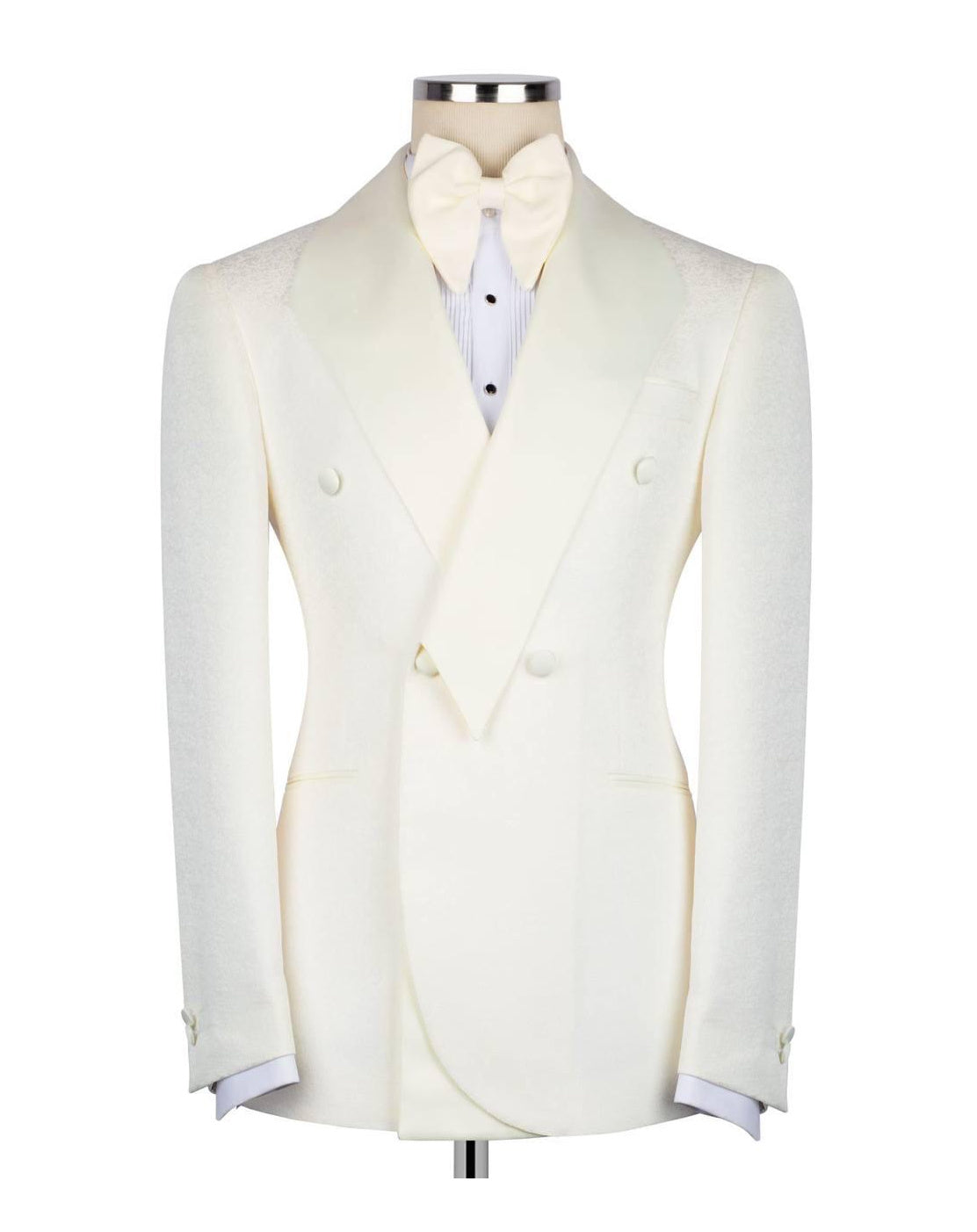 An ivory double-breasted tuxedo jacket with peak lapels, displayed on a mannequin torso with a matching bow tie and white shirt.