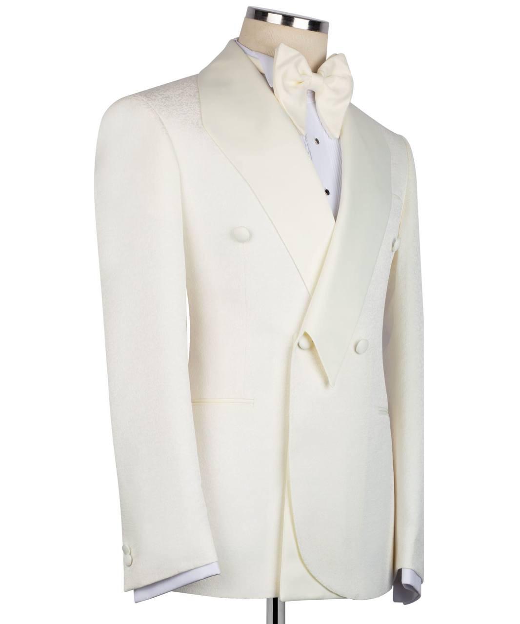 White tuxedo jacket on a mannequin with a white shirt and bow tie against a white background