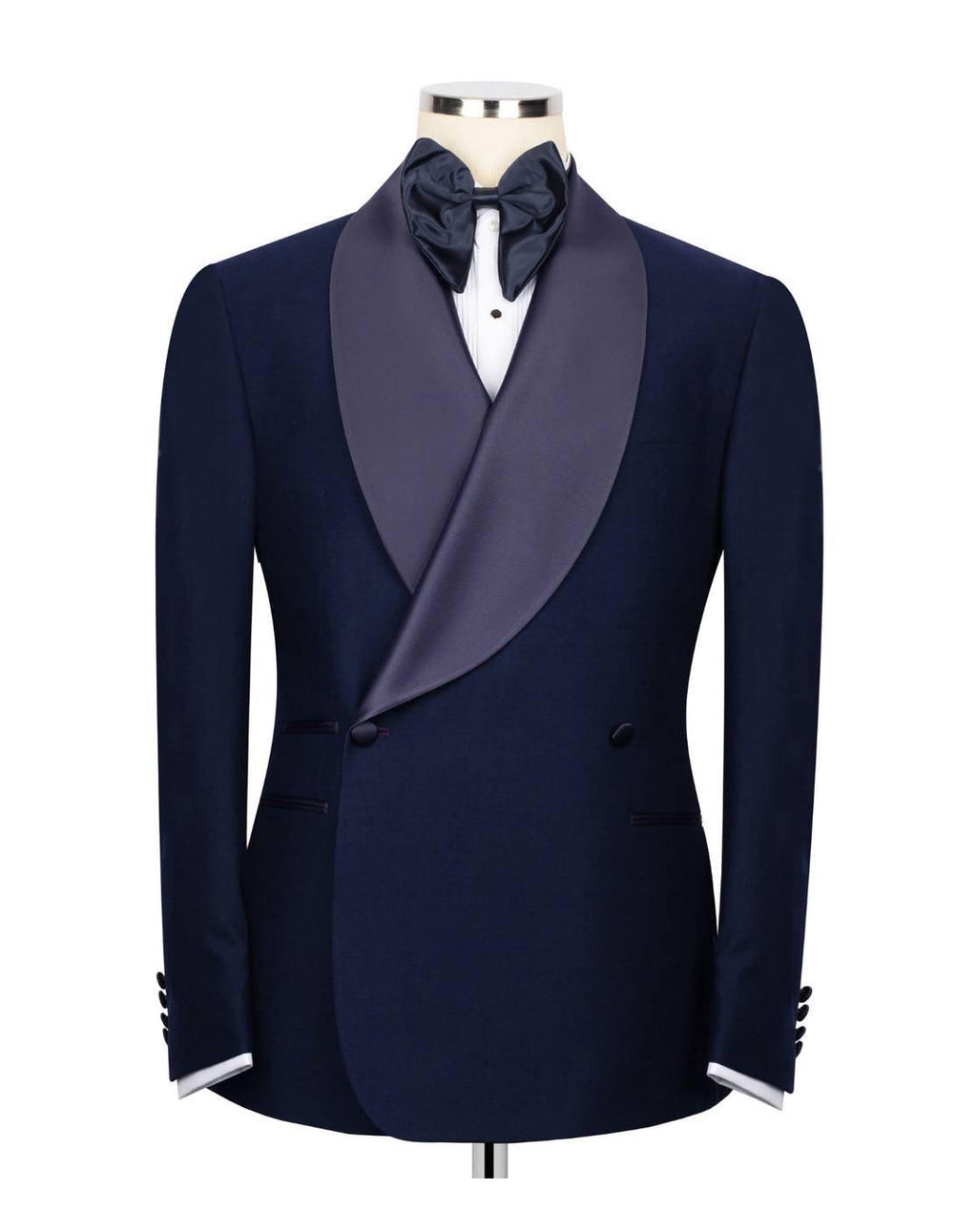 A men's navy blue tuxedo jacket with a satin peak lapel in a muted purple-gray color, styled on a mannequin with a white dress shirt, dark bow tie, and white cufflinks.