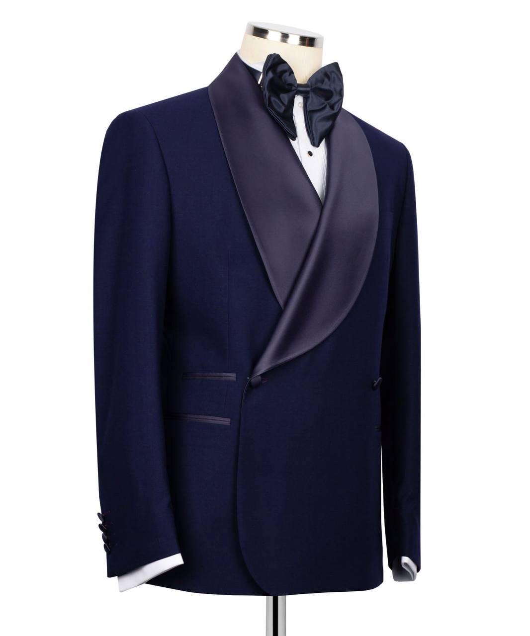 Navy blue tuxedo with satin lapels on a mannequin against a white background