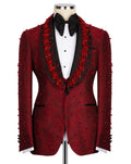 A red patterned tuxedo jacket with red floral bead embellishments, styled on a mannequin with a black bow tie and white shirt against a white background.