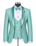 A mint green satin formal suit displayed on a mannequin, featuring a double-breasted jacket, matching vest, white pinstripe shirt, mint green bow tie, and silver chain detail against a white background.