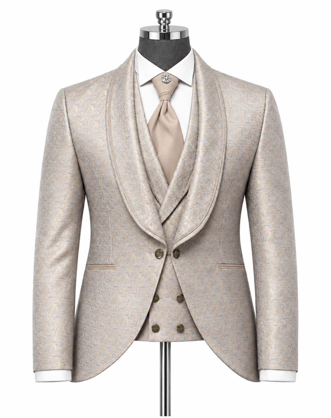 A men's formal suit displayed on a mannequin, featuring a light beige textured jacquard jacket with shawl lapels, a matching double-breasted waistcoat, a white dress shirt, and a beige tie.