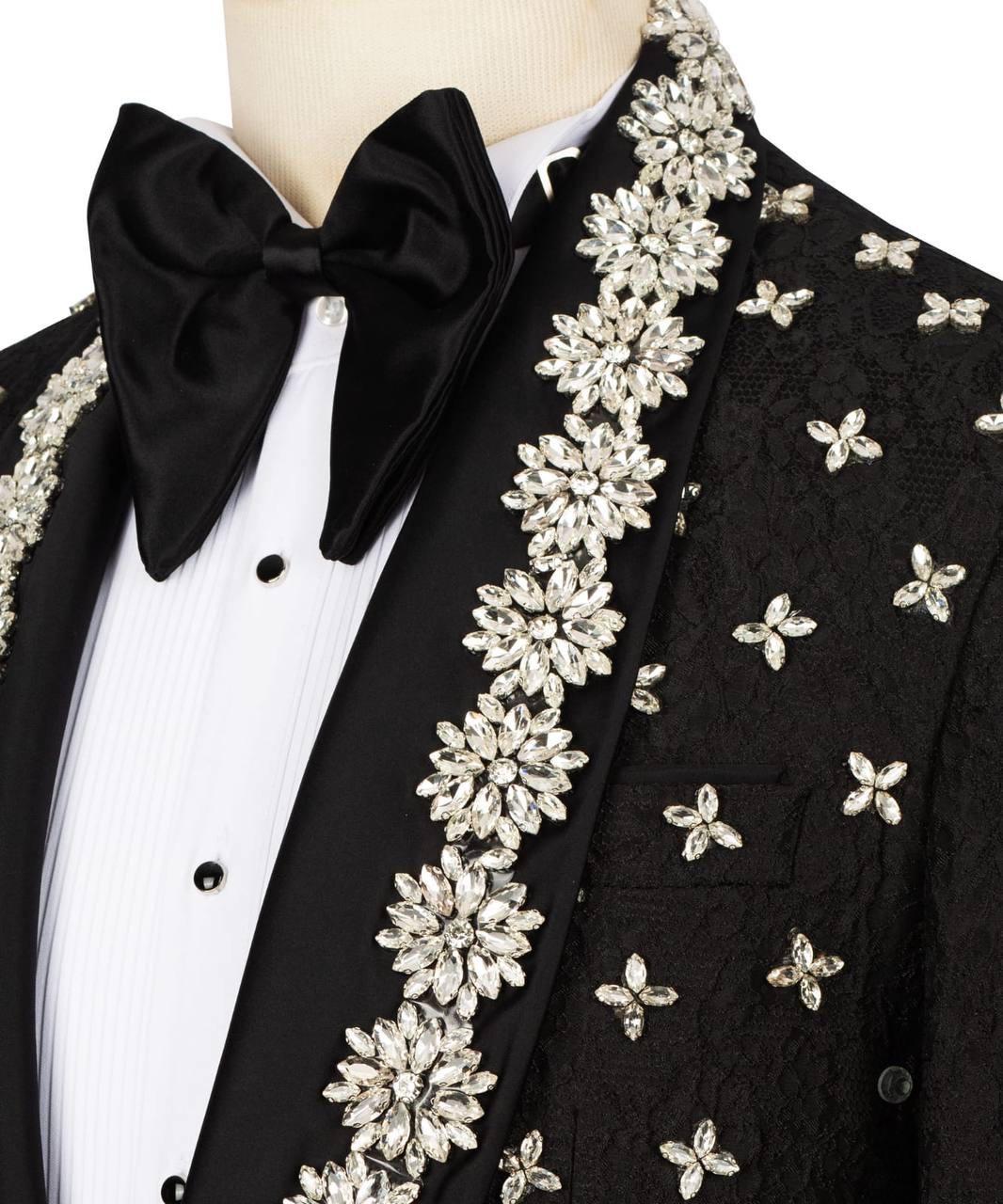 Black tuxedo with floral embellishments on a mannequin