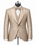 A men's formal tuxedo jacket with matching waistcoat and bow tie, displayed on a mannequin. The fabric is a champagne beige with a subtle floral damask pattern.