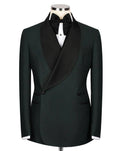A black double-breasted tuxedo jacket with satin peak lapels, displayed on a mannequin with a black bow tie and white dress shirt against a light gray background.