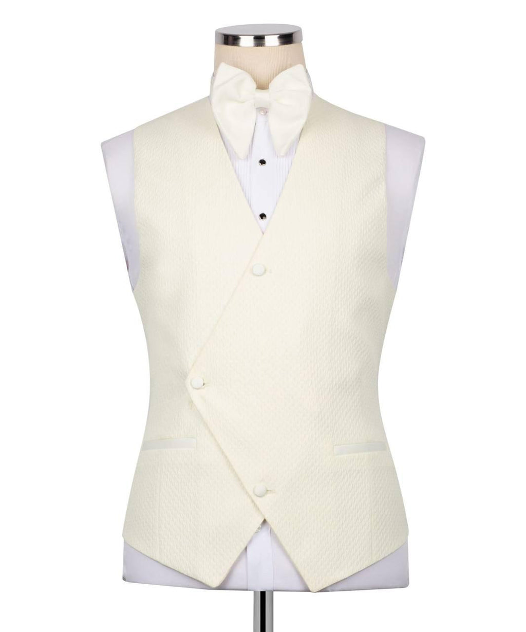 An ivory textured waistcoat vest displayed on a mannequin torso with a matching bow tie and white dress shirt, set against a plain white background.