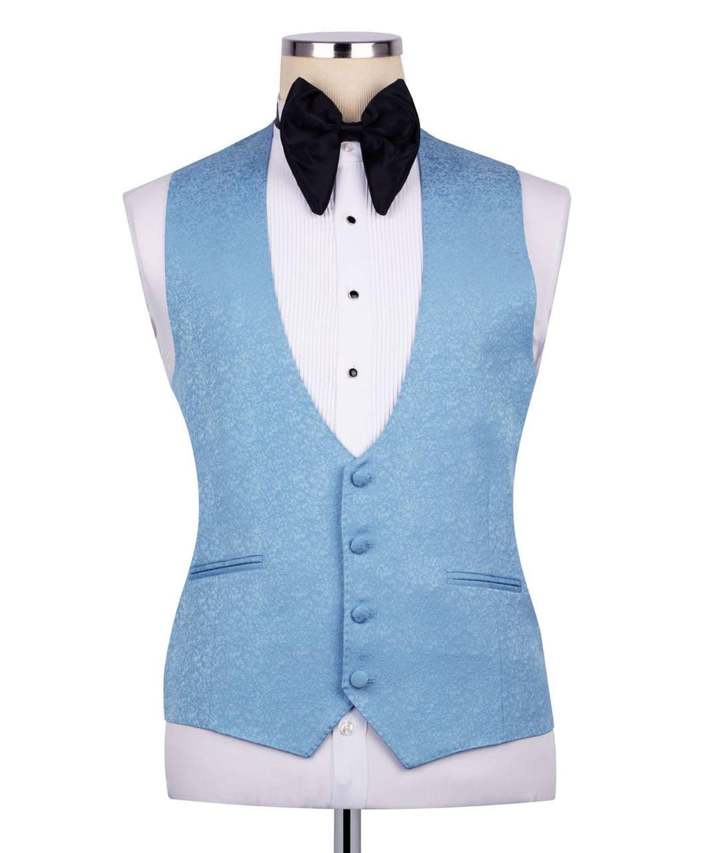 A light blue textured formal vest displayed on a white tuxedo shirt mannequin with a black bow tie, against a plain white background.