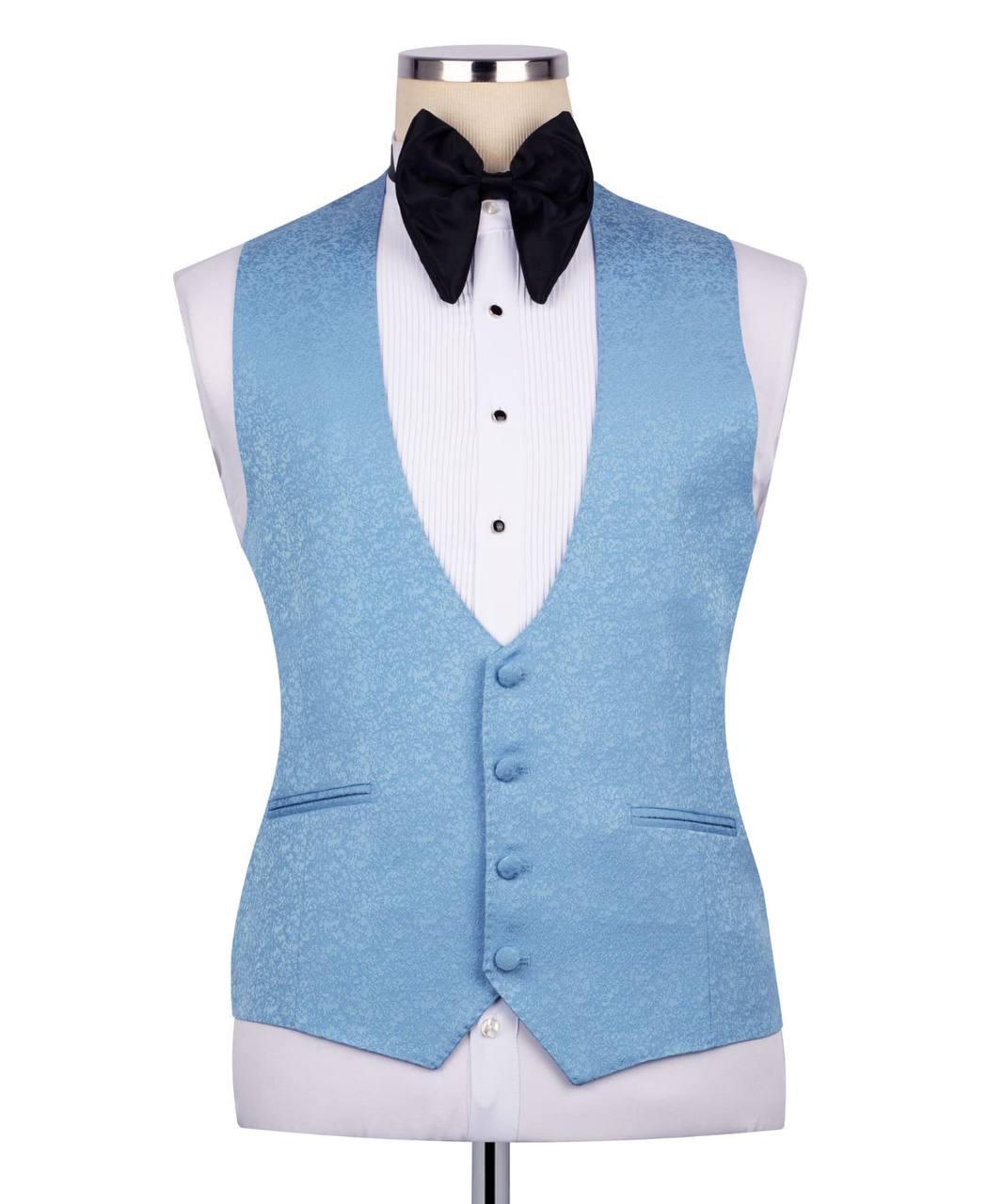 A light blue textured formal vest displayed on a white tuxedo shirt mannequin with a black bow tie, against a plain white background.