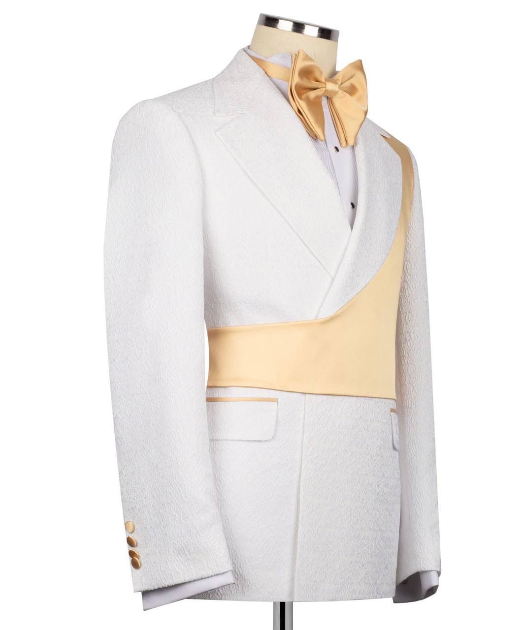White tuxedo with gold accents on a mannequin against a white background