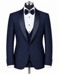 A navy blue tuxedo jacket with black satin shawl collar, styled on a mannequin with a white pinstripe shirt, matching navy vest, black bow tie, and white cufflinks.