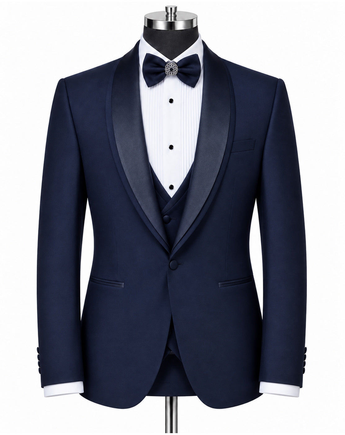 A navy blue tuxedo jacket with black satin shawl collar, styled on a mannequin with a white pinstripe shirt, matching navy vest, black bow tie, and white cufflinks.