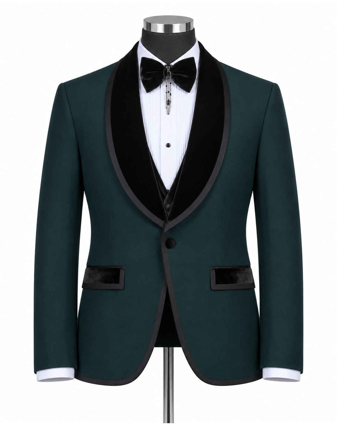 A men's formal tuxedo jacket in dark green with black velvet shawl lapels, displayed on a mannequin with a white dress shirt, black bow tie, and black vest.