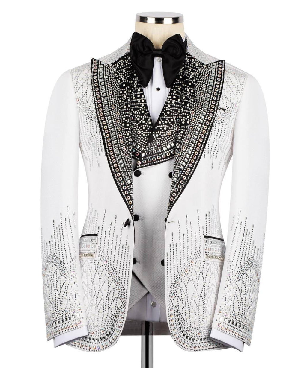 Elegant white tuxedo with black embellishments on a mannequin against a white background