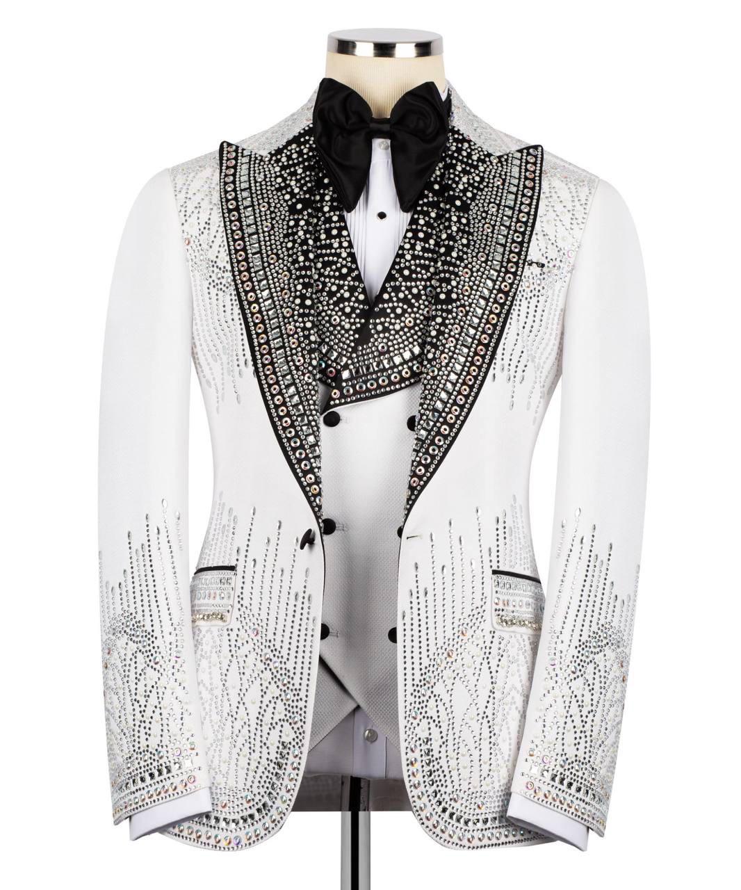 Elegant white tuxedo with black embellishments on a mannequin against a white background