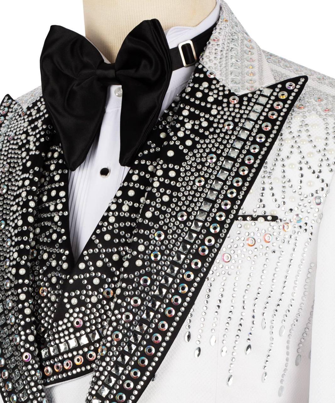 Elegant tuxedo with black bow tie and crystal embellishments on a mannequin.