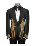 A dark green tuxedo jacket with black satin lapels and elaborate gold sequin and bead embroidery on the front and cuffs, displayed on a mannequin with a black bow tie and white shirt.