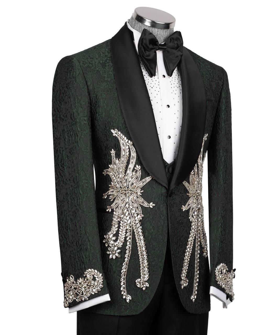 Green tuxedo with intricate silver embroidery on a mannequin against a white background