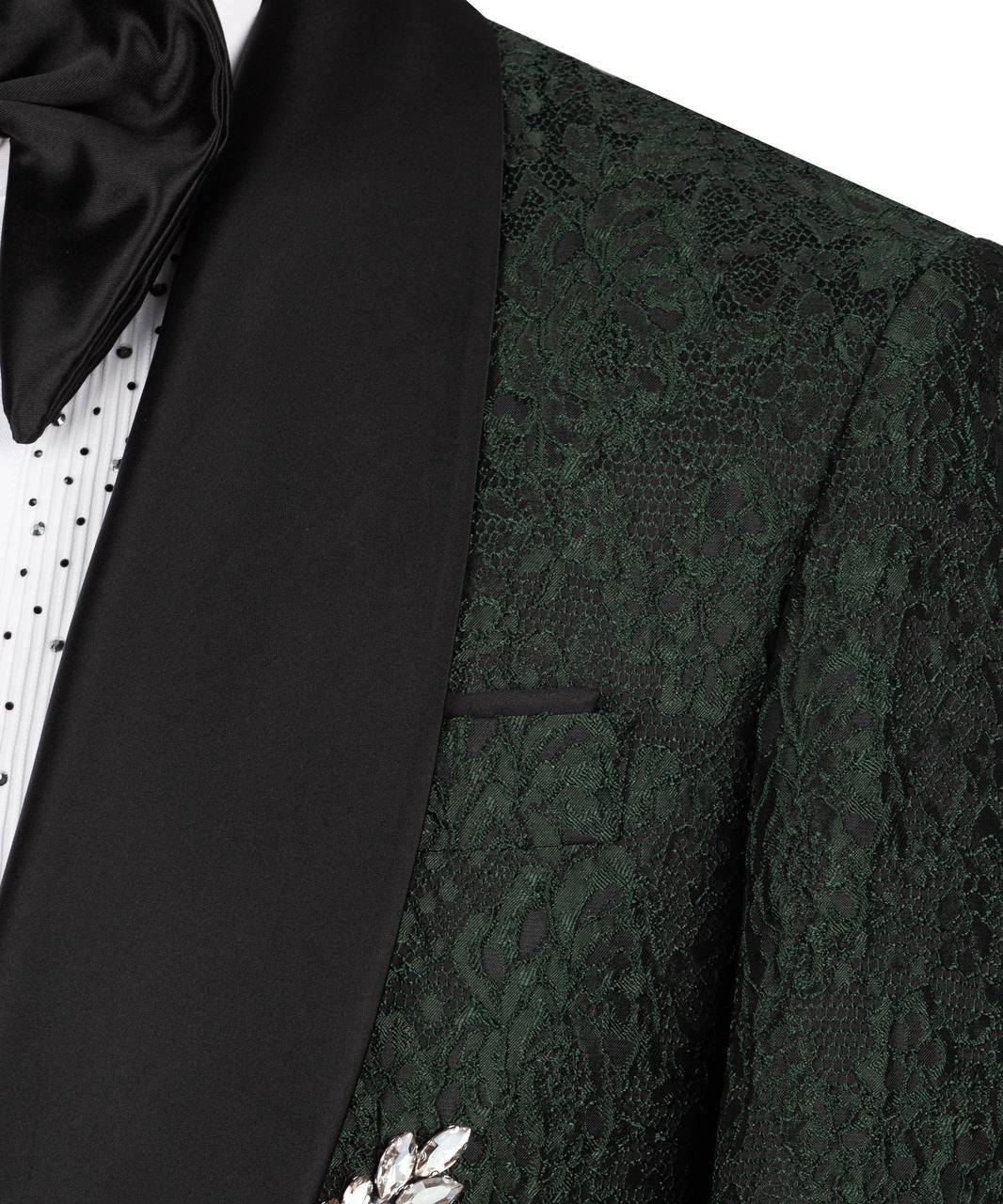 Close-up of a black tuxedo with a bow tie and floral details on a white background