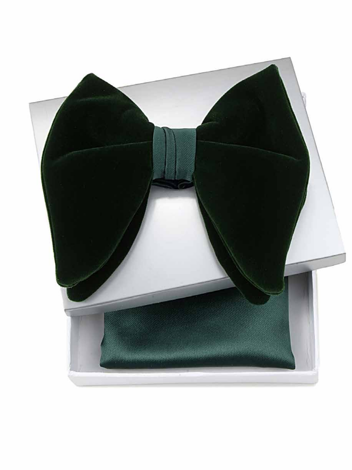 A dark forest green velvet bow tie presented on top of an open white gift box, with a matching green satin pocket square visible inside the box.