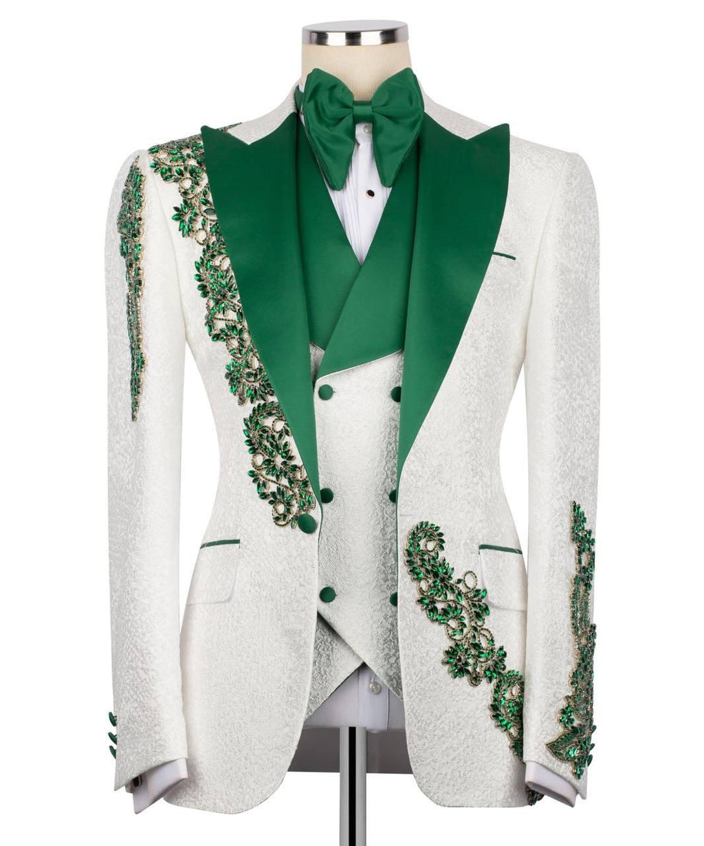 White tuxedo with green embellishments on a mannequin against a white background