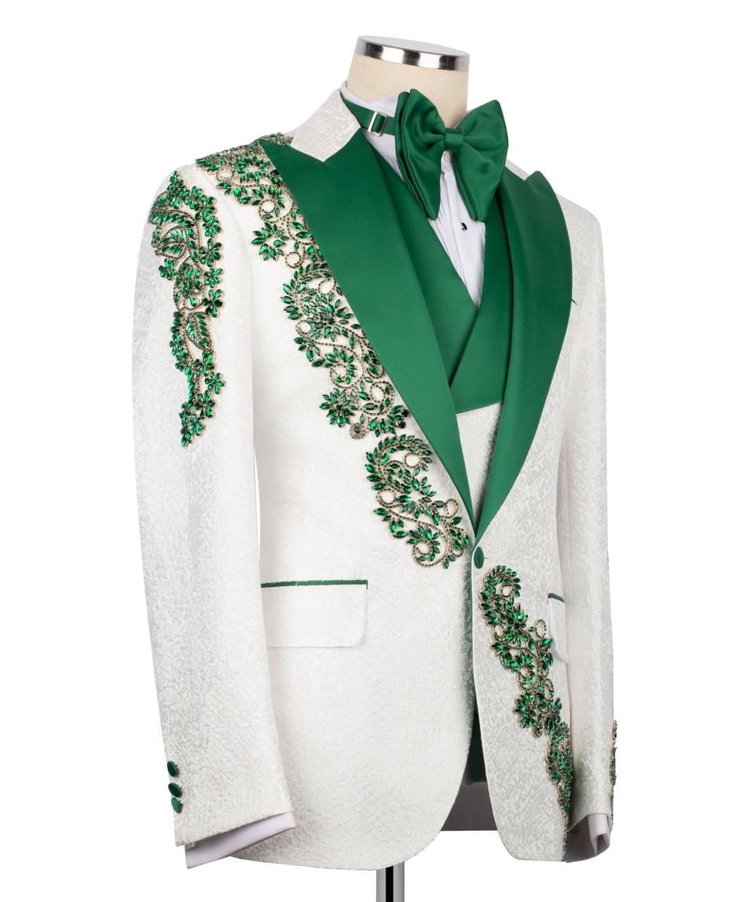 White blazer with green embellishments on a mannequin against a white background