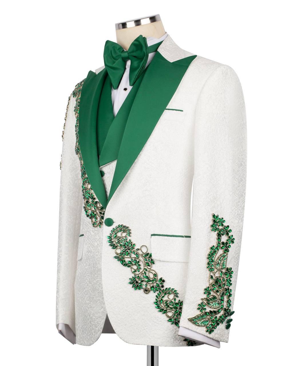 White tuxedo with green lapels and embellishments on a mannequin against a white background