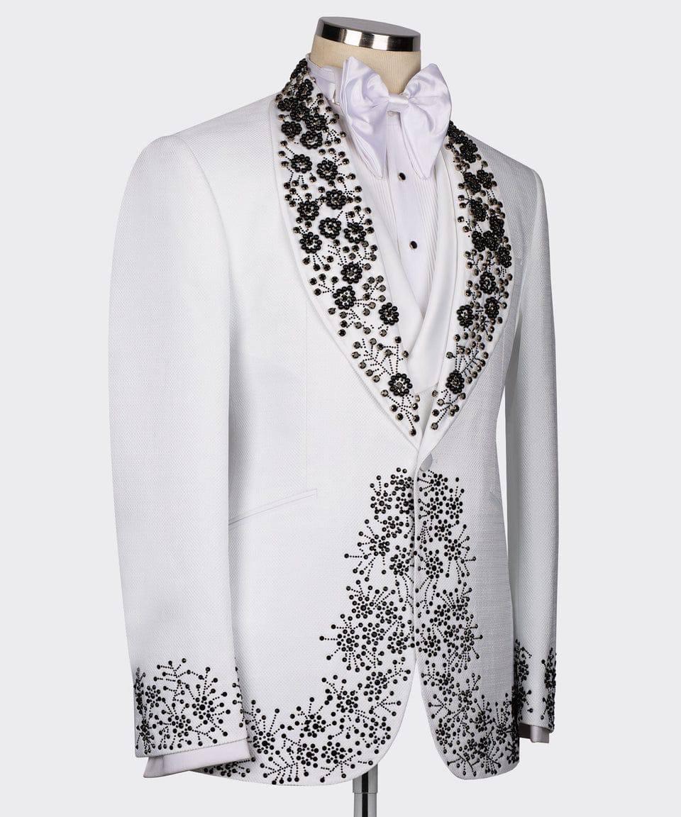 White tuxedo with black floral embroidery on a mannequin against a white background