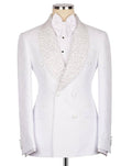 A white double-breasted tuxedo jacket with textured, patterned shawl lapels, displayed on a mannequin with a white bow tie and white dress shirt.