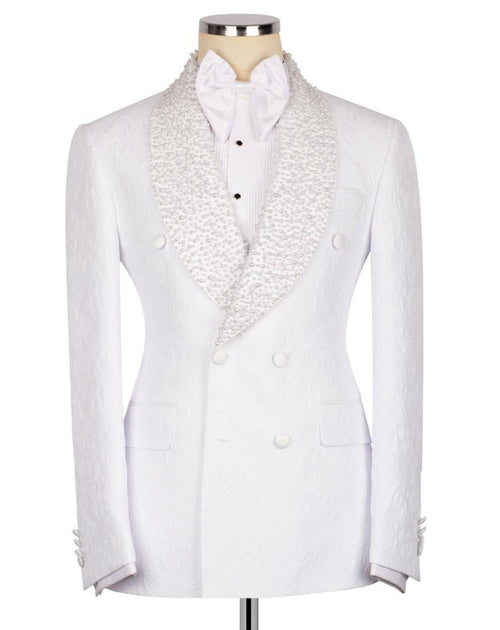 A white double-breasted tuxedo jacket with textured, patterned shawl lapels, displayed on a mannequin with a white bow tie and white dress shirt.